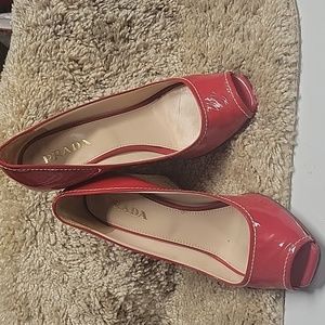 Prada red wedge sandals very pretty. 3inch heel, used good condition.size 35 1/2